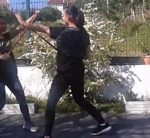 Practicing stick fighting movements